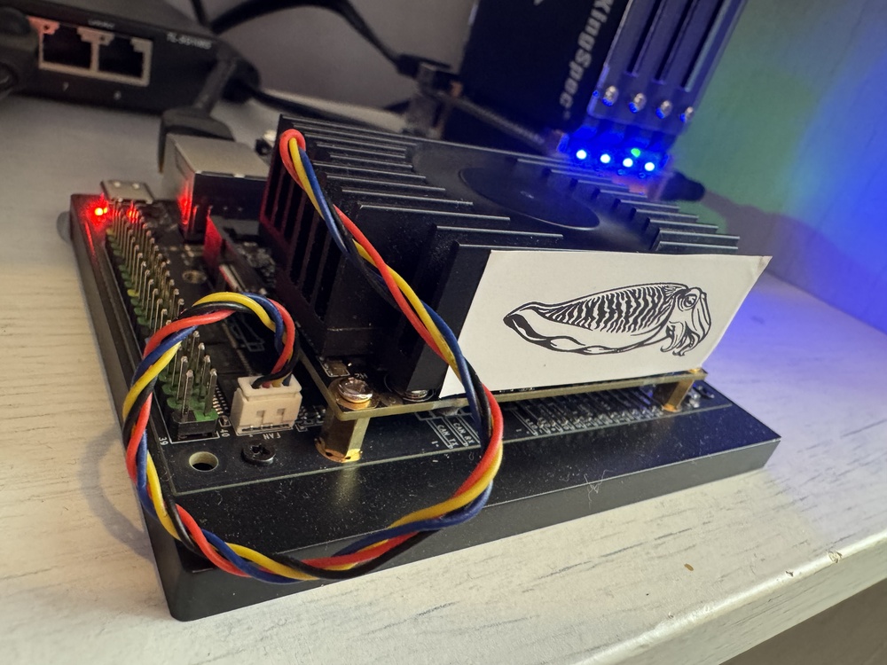 Agent Cuttlefish hardware — a Turing Pi RK1 board housed in a custom 3D-printed cuttlefish sculpture with colour-changing LED lights